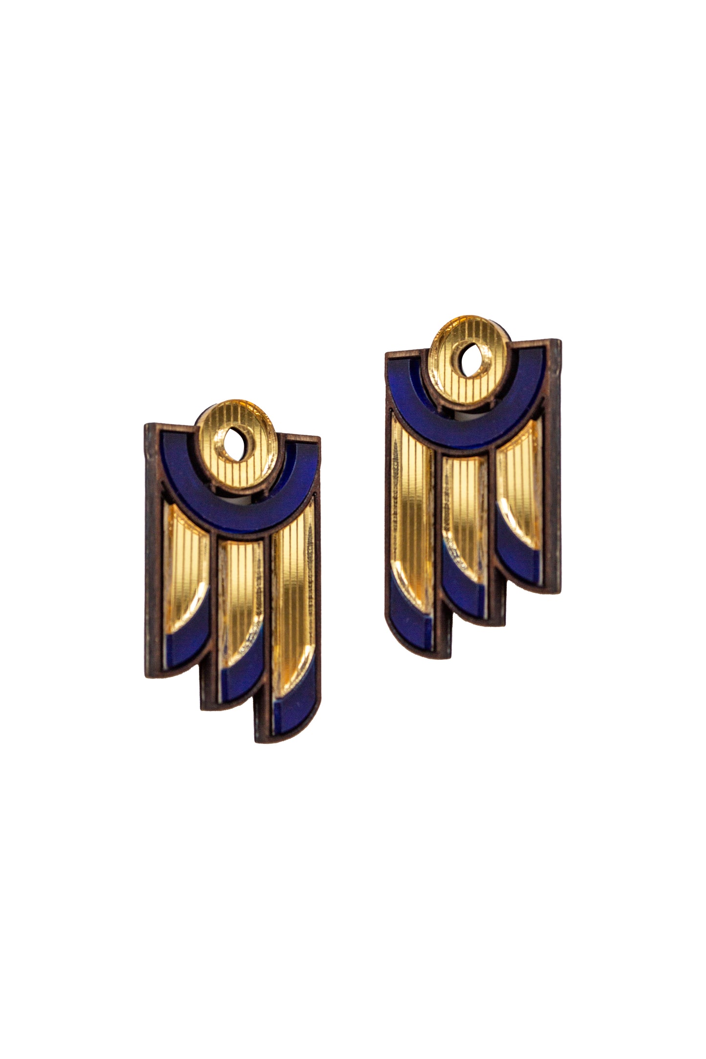 Pair of laser cut gold and navy geometric earrings on a white background. Made from acrylic, plywood and walnut wood