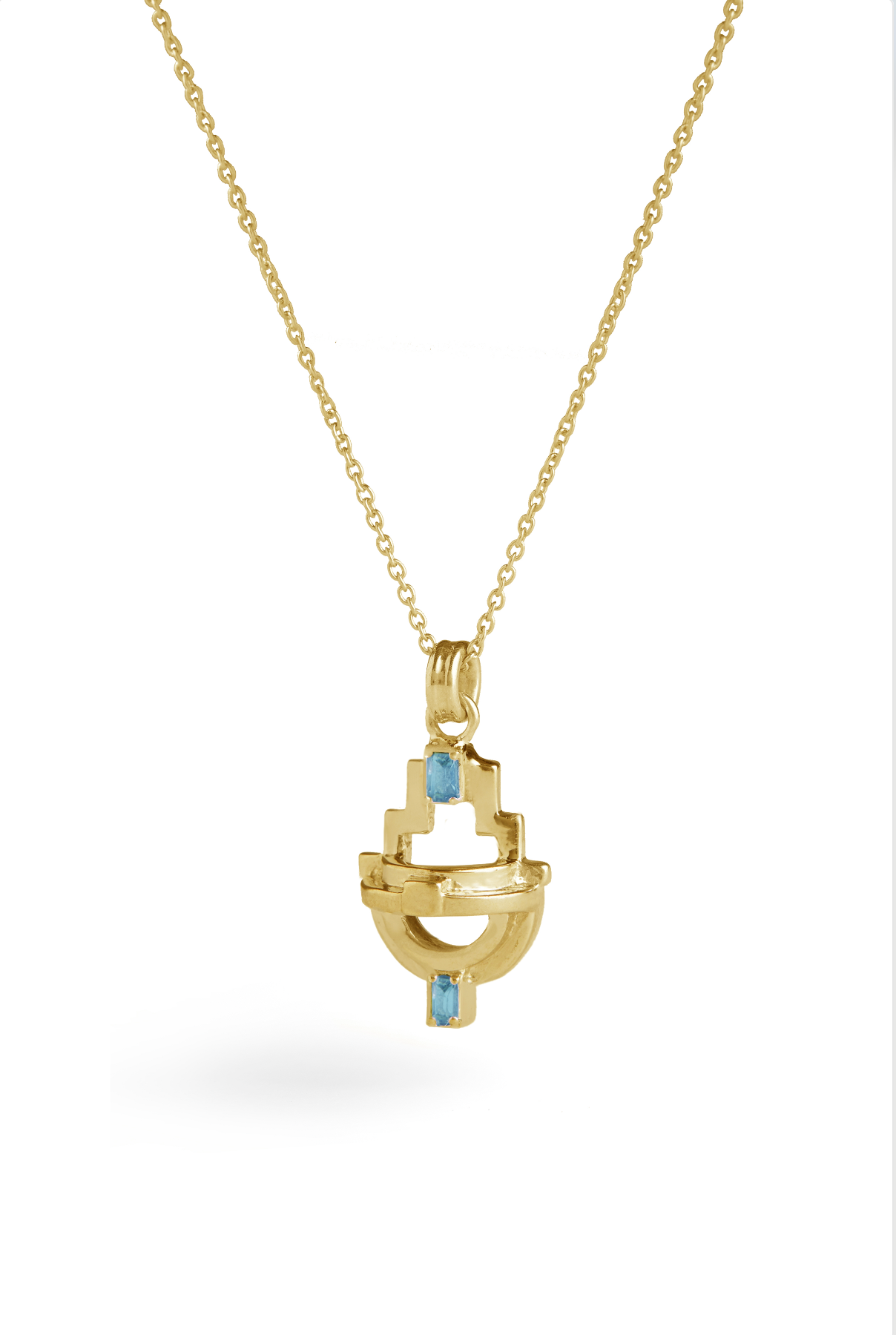 Gold necklace with a pendant featuring blue topaz gemstones on a white background.