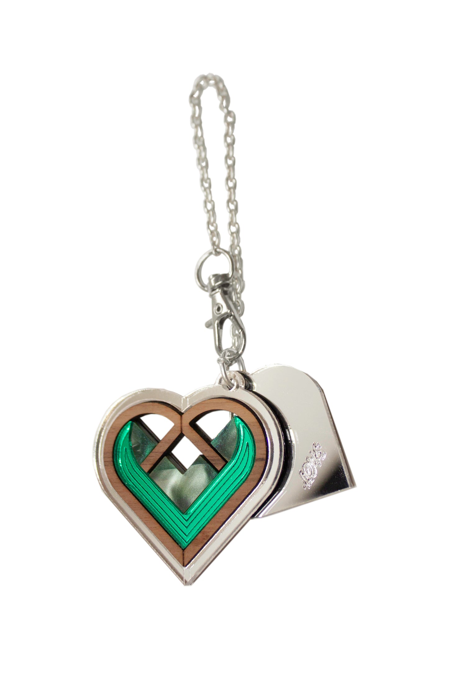 Heart-shaped bag charm with green interior and silver chain on a white background. Laser cut bag charm made from plywood, walnut wood and acrylic
