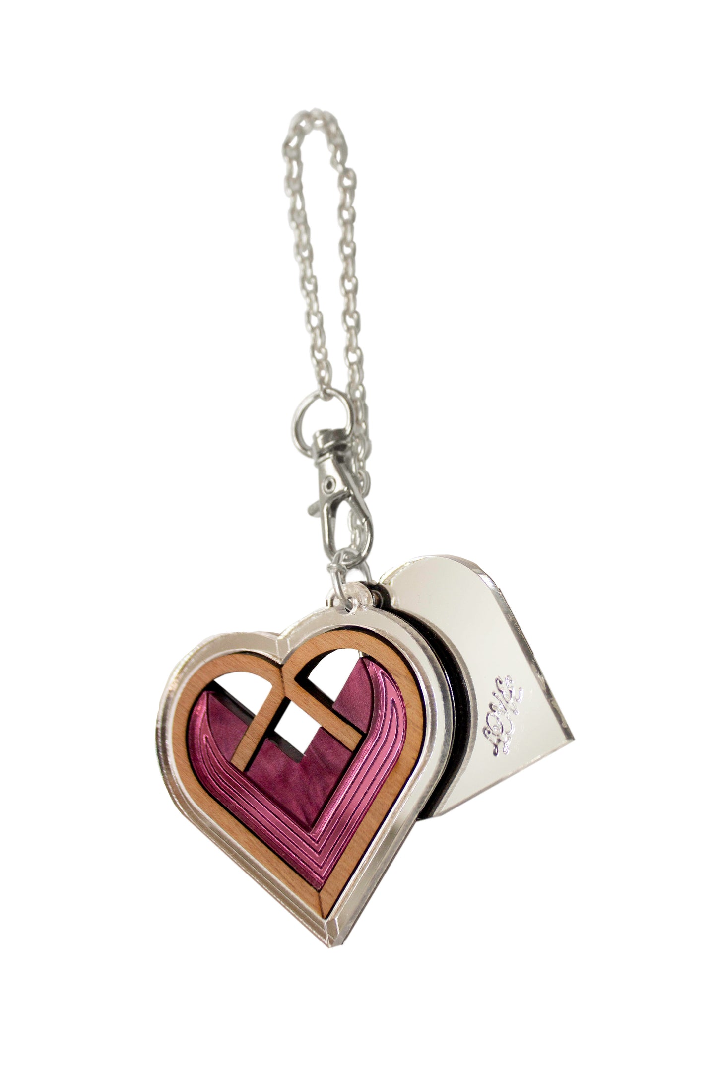 Pink and silver Heart-shaped keychain, or bag charm with a silver chain on a white background. Handmade from walnut wood and acrylic