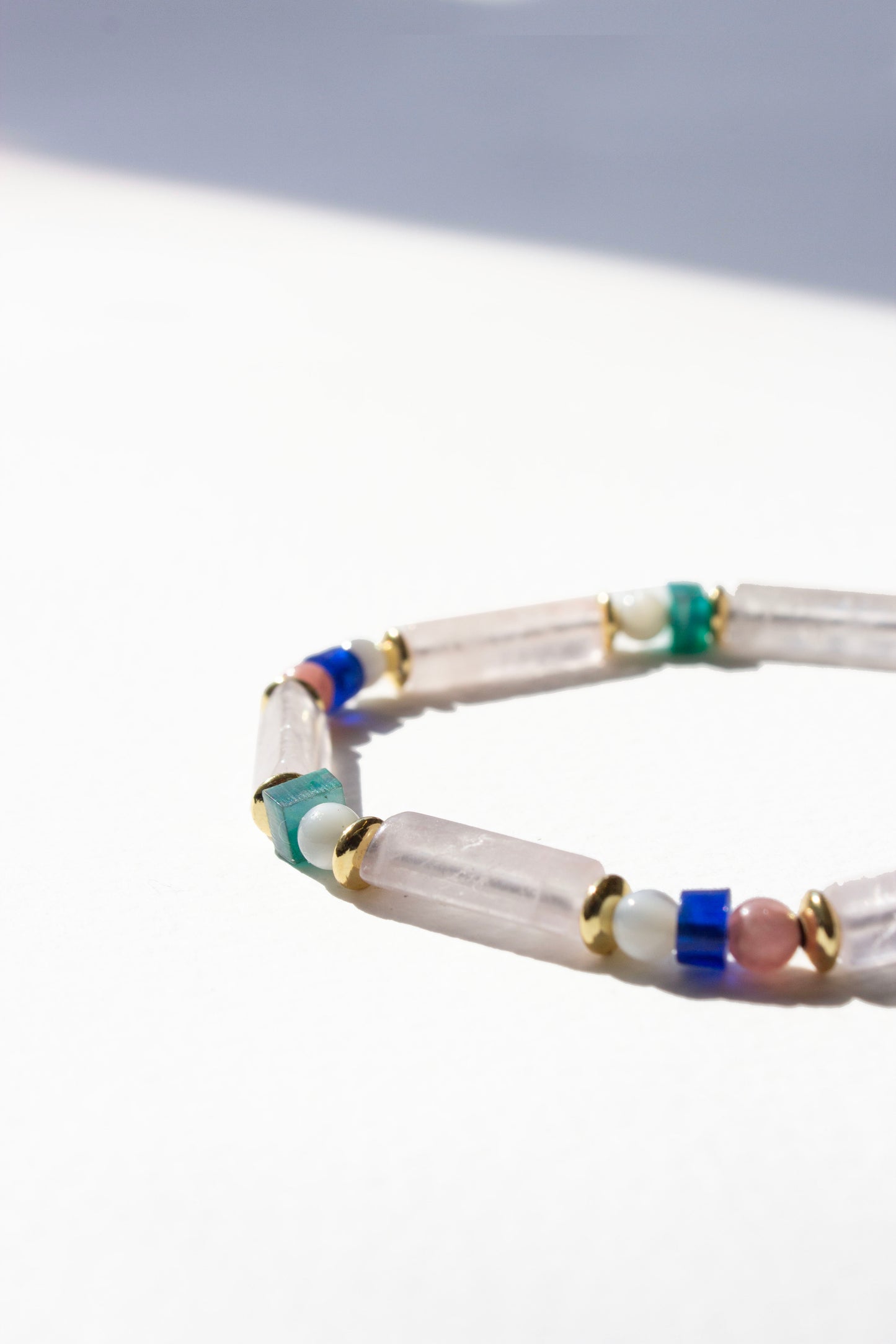 Multicolored beaded bracelet on a white background