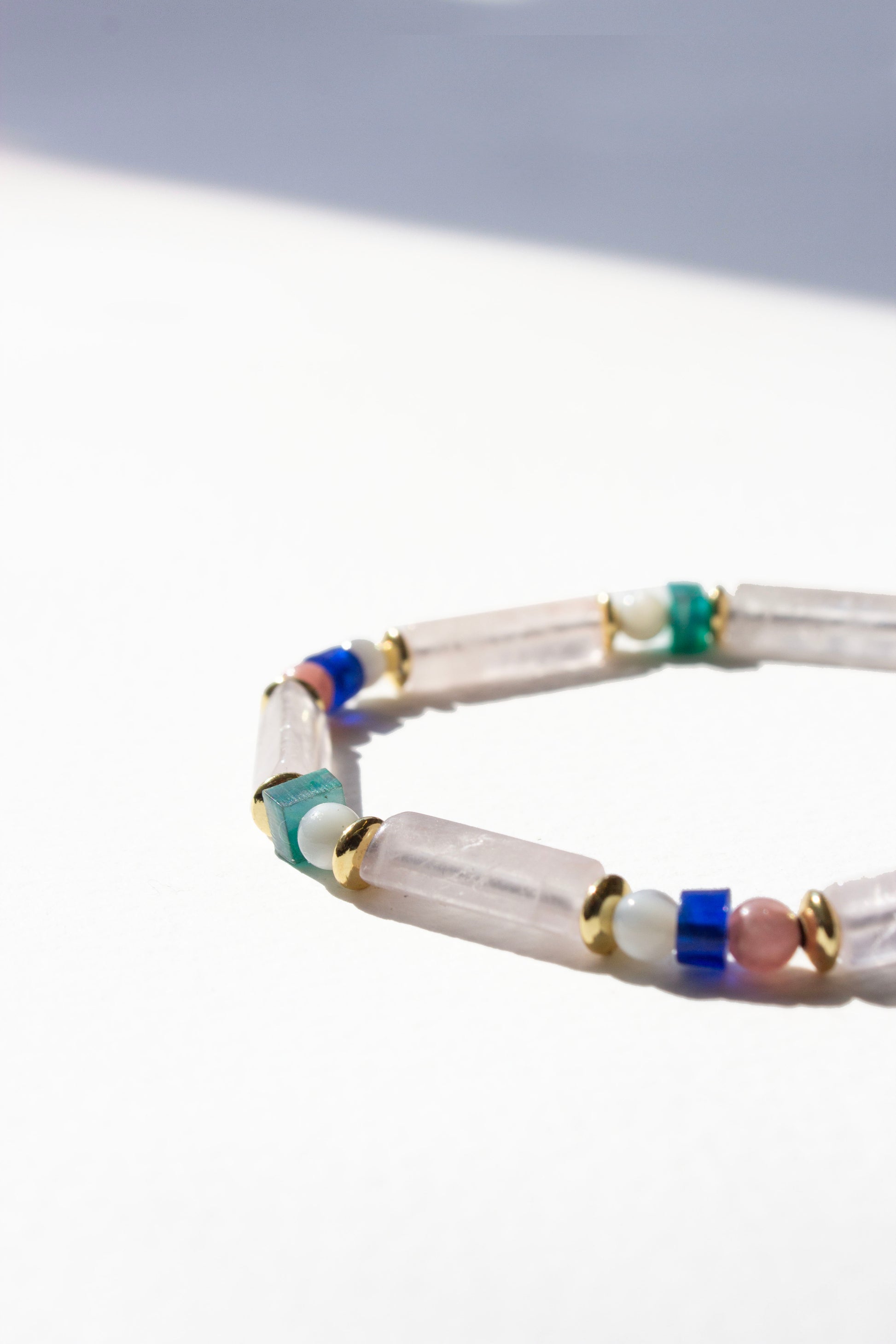 Multicolored beaded bracelet on a white background
