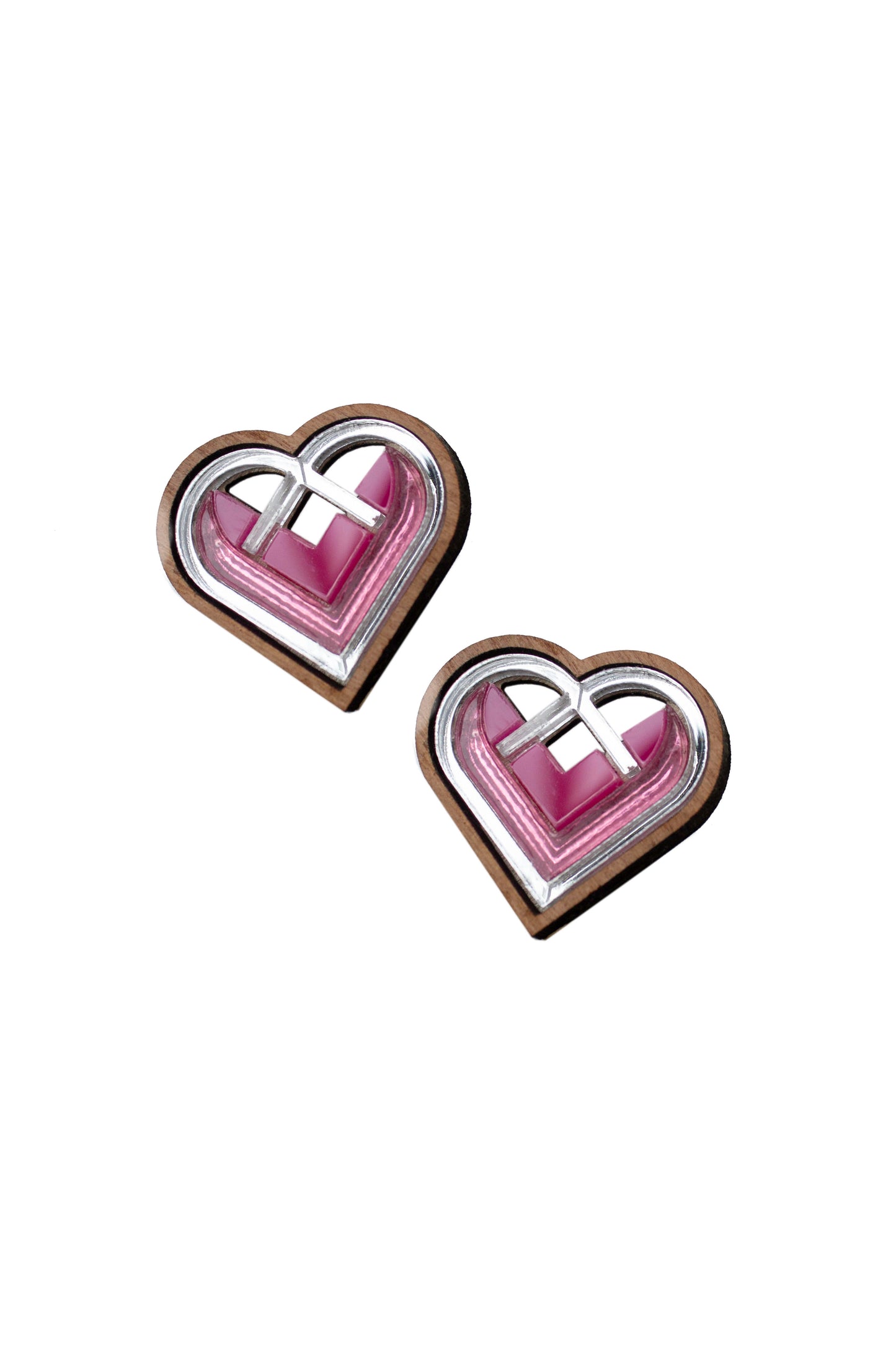Valentines, Heart-shaped earrings with pink and and silver design on a white background. Laser cut earring, made from walnut wood and acrylic