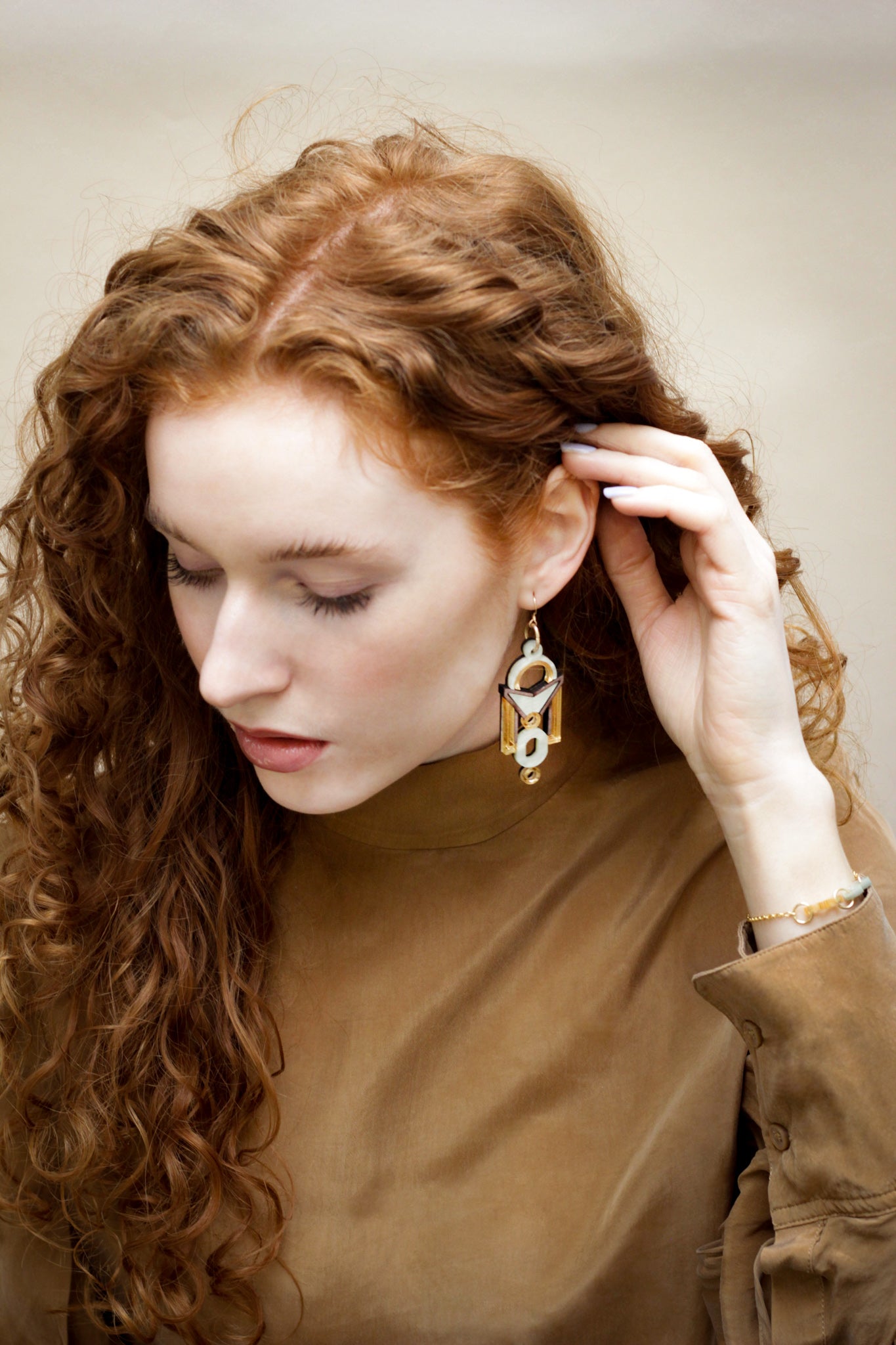 Florence Earrings, bold architectural statement earrings worn on model
