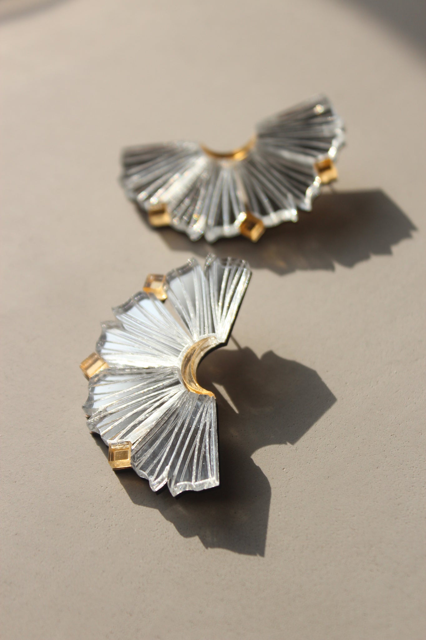 Nalla Earrings - Silver & Gold image showing laser cut acrylic. fan like earrings shape